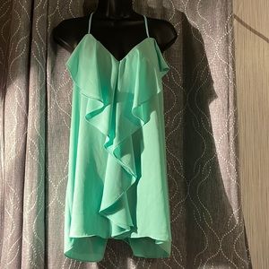 Maurice’s teal shirt